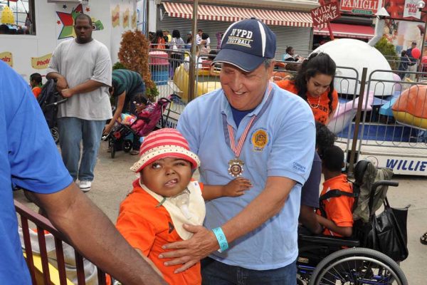 Community Mayor volunteer and child at Deno's Wonder Wheel