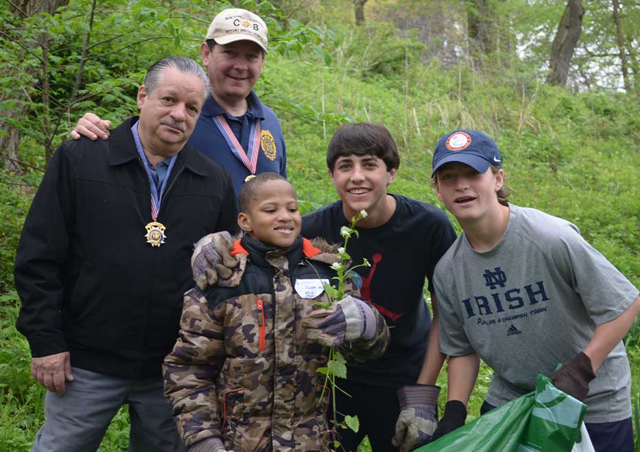 Community Mayors volunteers and little boy during Earth Day event