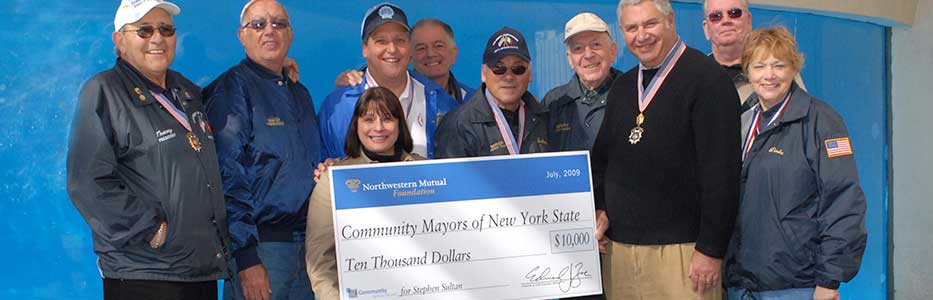 Group of Community Mayors accepting a $10,000 donation