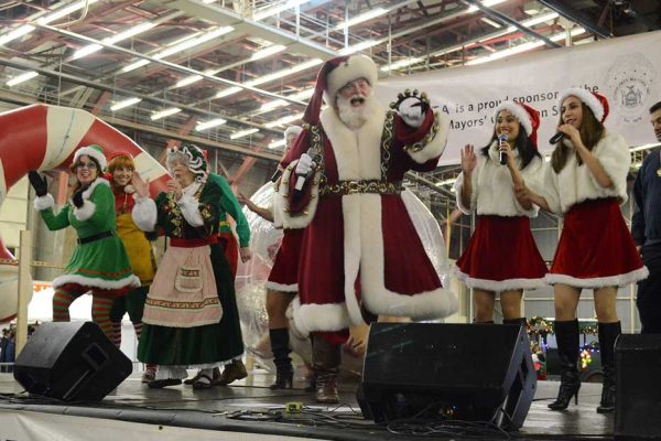 Santa Claus with volunteer performers at Community Mayors Operation Santa Claus special event