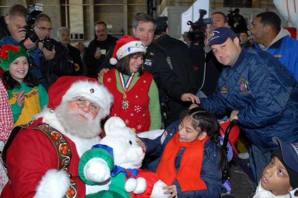 Santa Claus and child at Operation Santa Claus event